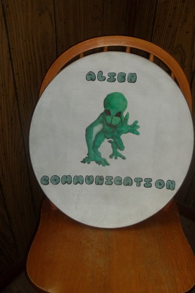 Alien on a satellite dish.