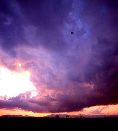 Airplane in sunset clouds in Majorca
