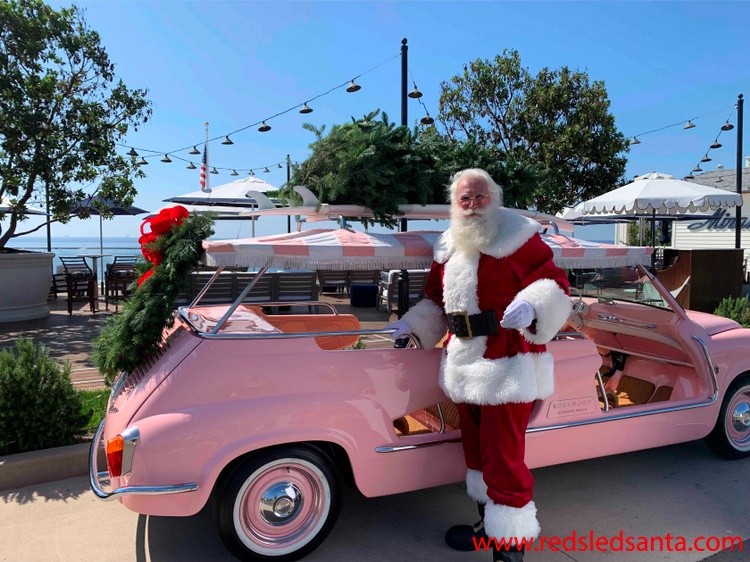 red sled santa with car