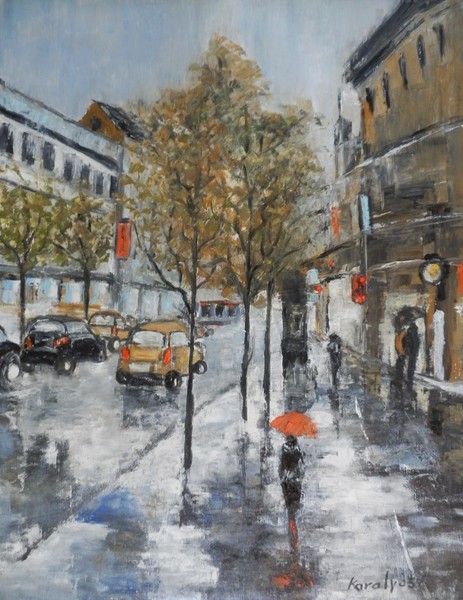 A woman with a red umbrella