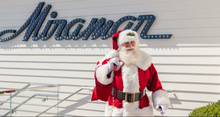red sled santa with gift