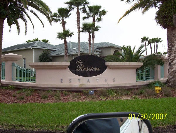 deep carved granite oval sign