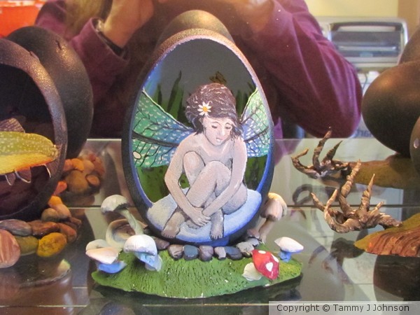 fairy on emu egg. mushroom stand