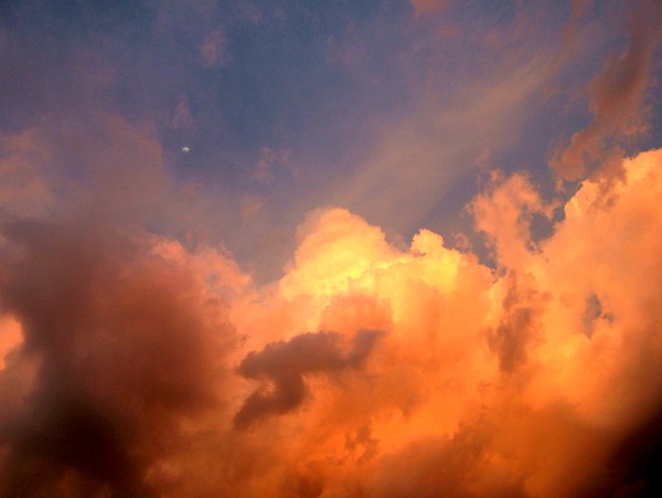 Setting Sun, rising clouds