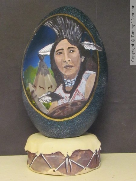 native man on emu egg