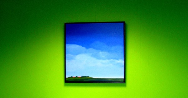 Green wall, blue art.