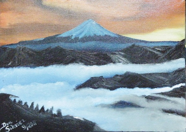 Mt Fuji through the mountains and clouds