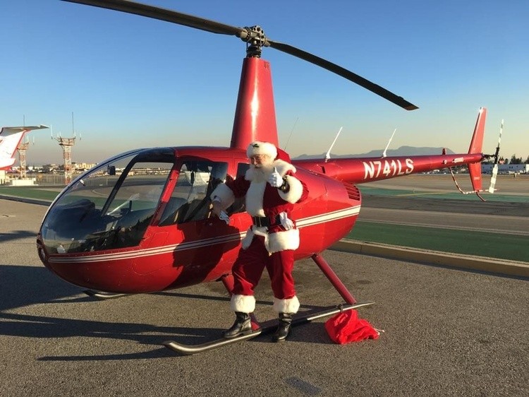 redsledsanta in helicopter