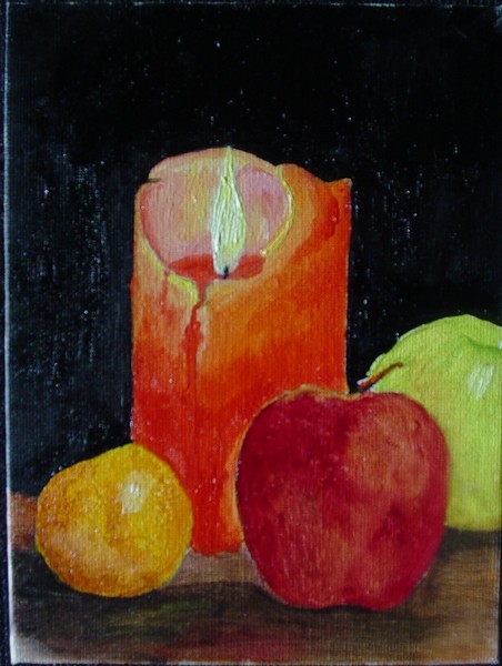 A candle and fruit