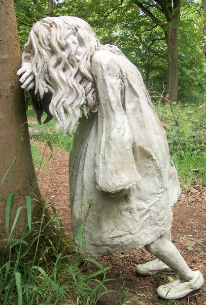 Little Girl Against Tree