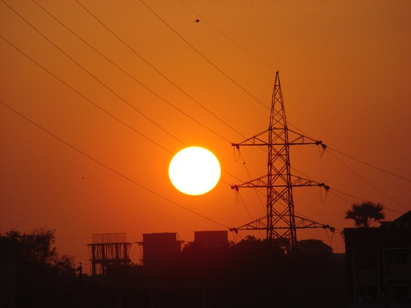 Sun ....behind the electric taars....
