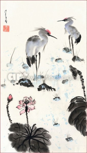 Two herons in a lotus pond.