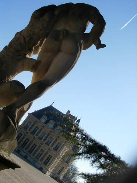 man with a child and a view of chateau