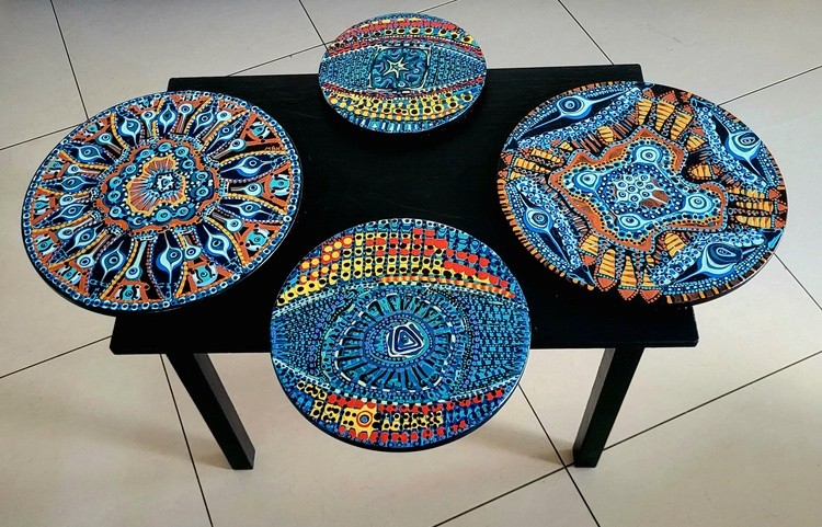 Living room table with artwork pasted on it by Mirit Ben-Nun