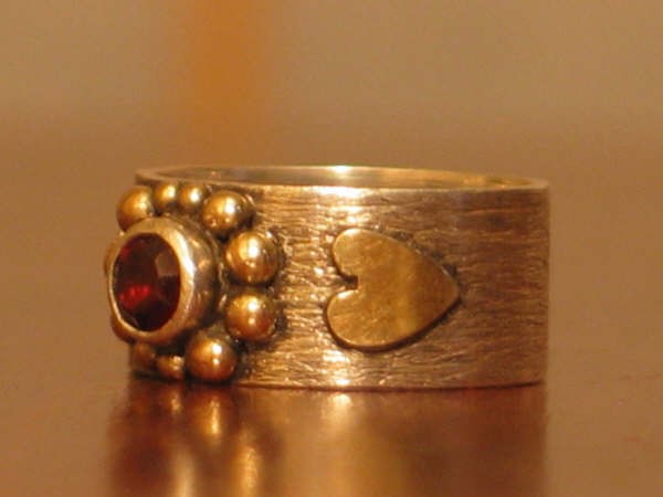 sterling silver, 14kt. gold and red garnet