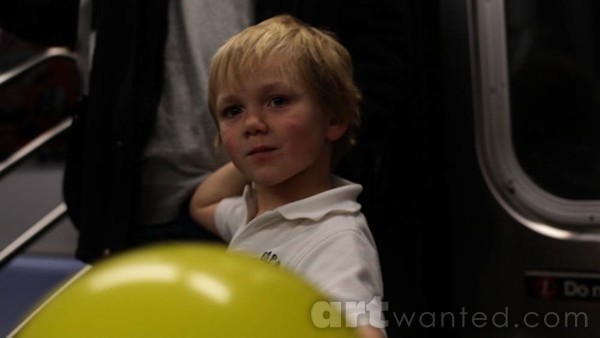 boy with yellow balloon