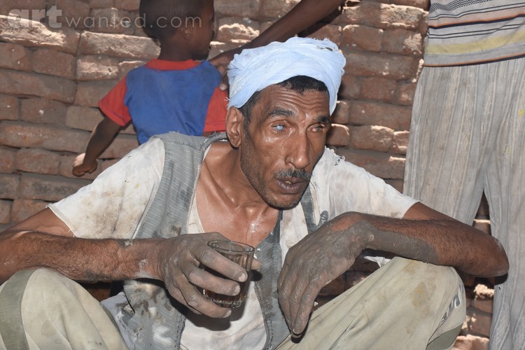 A blind Egyptian working in the manufacture of pot