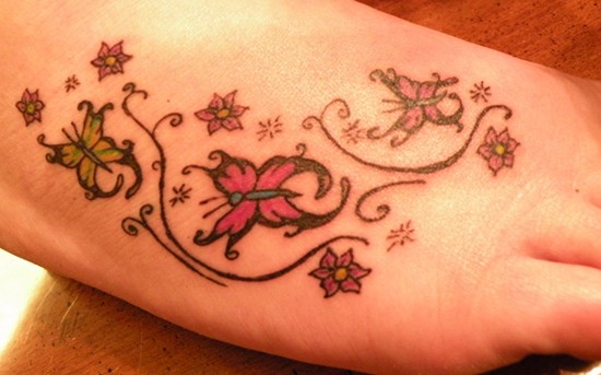 Butterfly foot tattoo