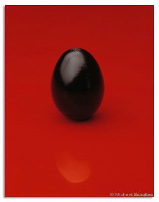 black egg on red
