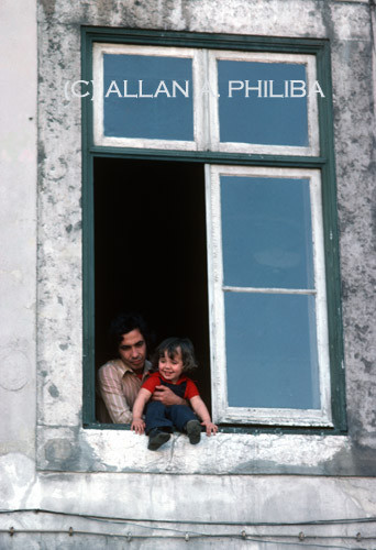 Father and Daughter in Window
