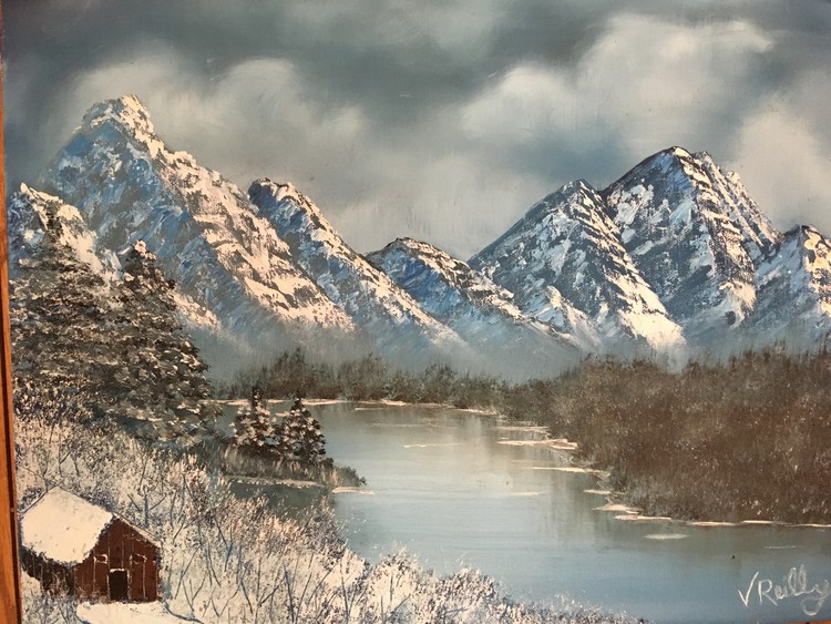 Snowy cabin by the lake