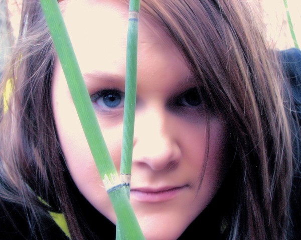 Alicia looking through Grass