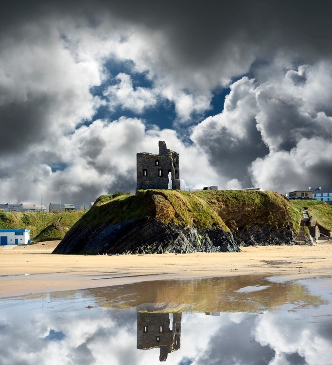 wild atlantic way castle ruins and cloudy beach