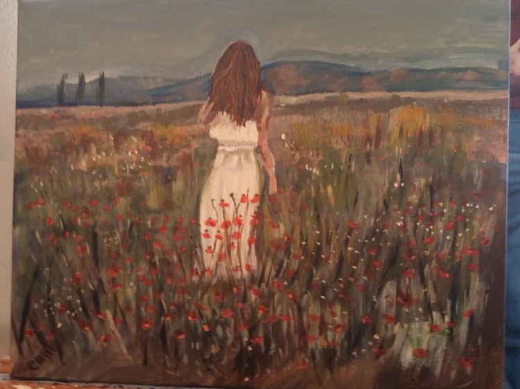 Woman in a poppy field