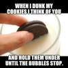 Dunking cookies Thinking of you Holding down in milk until bubbles stop