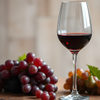Wine Glass and Grapes on Wooden Table