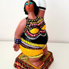 Woman clay sculpture that I bought and painted with acrylic color. Mirit Ben-Nun Israeli artist.